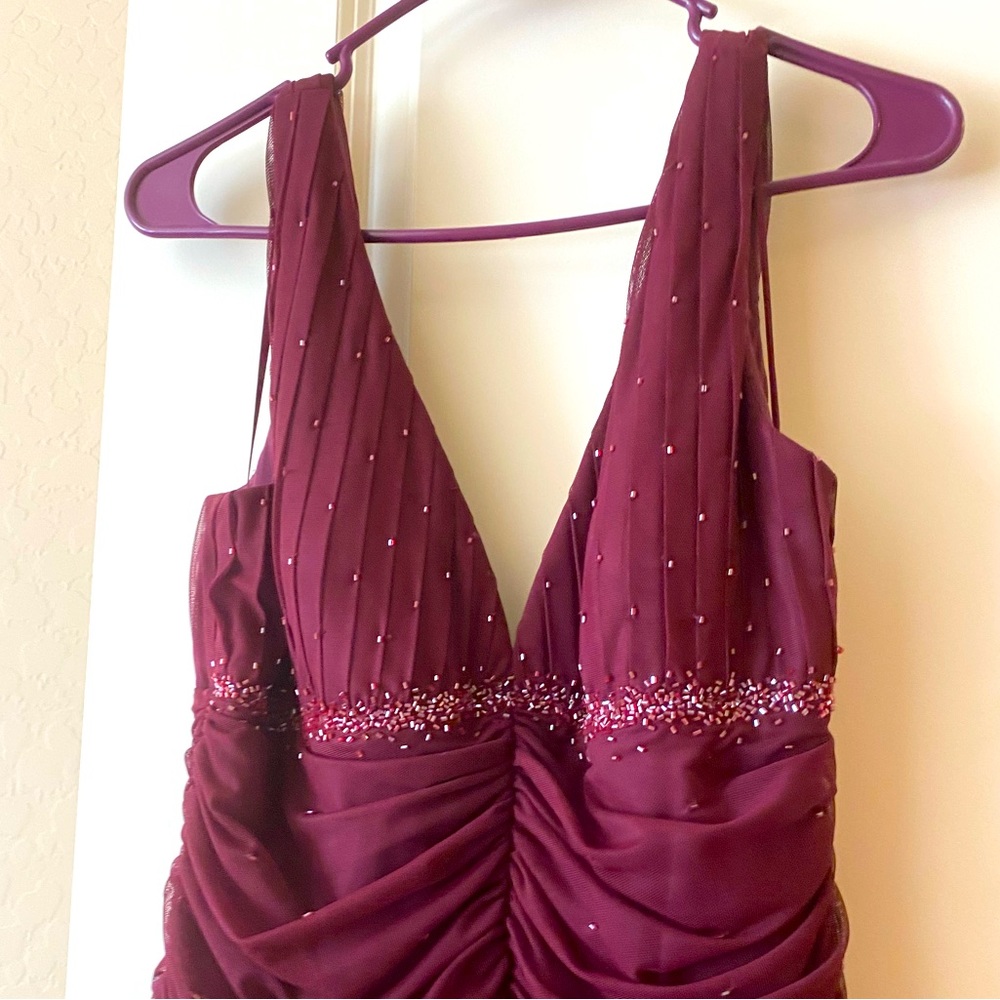 Evening gown, beautiful burgundy gown with beads on top and velvet bottom.